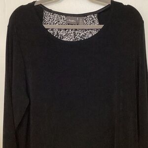 Chico’s Travelers Women’s top,size XL, Black with split back and printed insert.